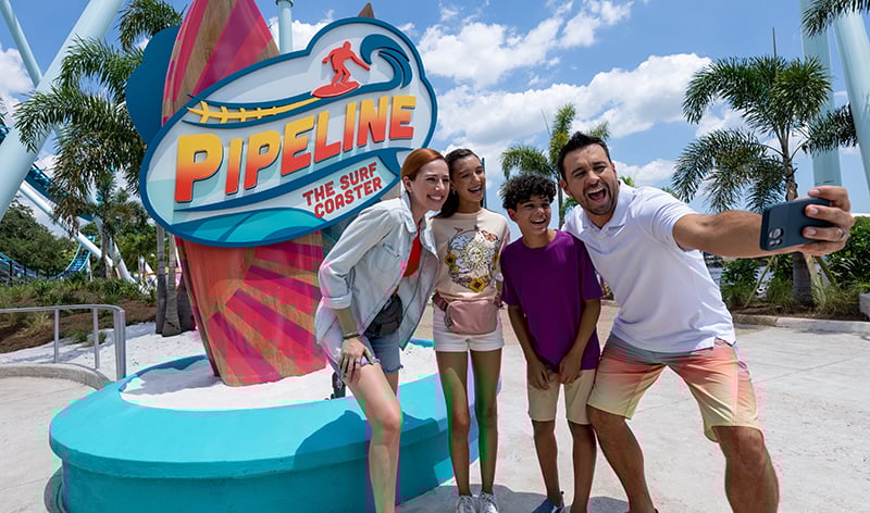 Family selfie near Pipeline sign